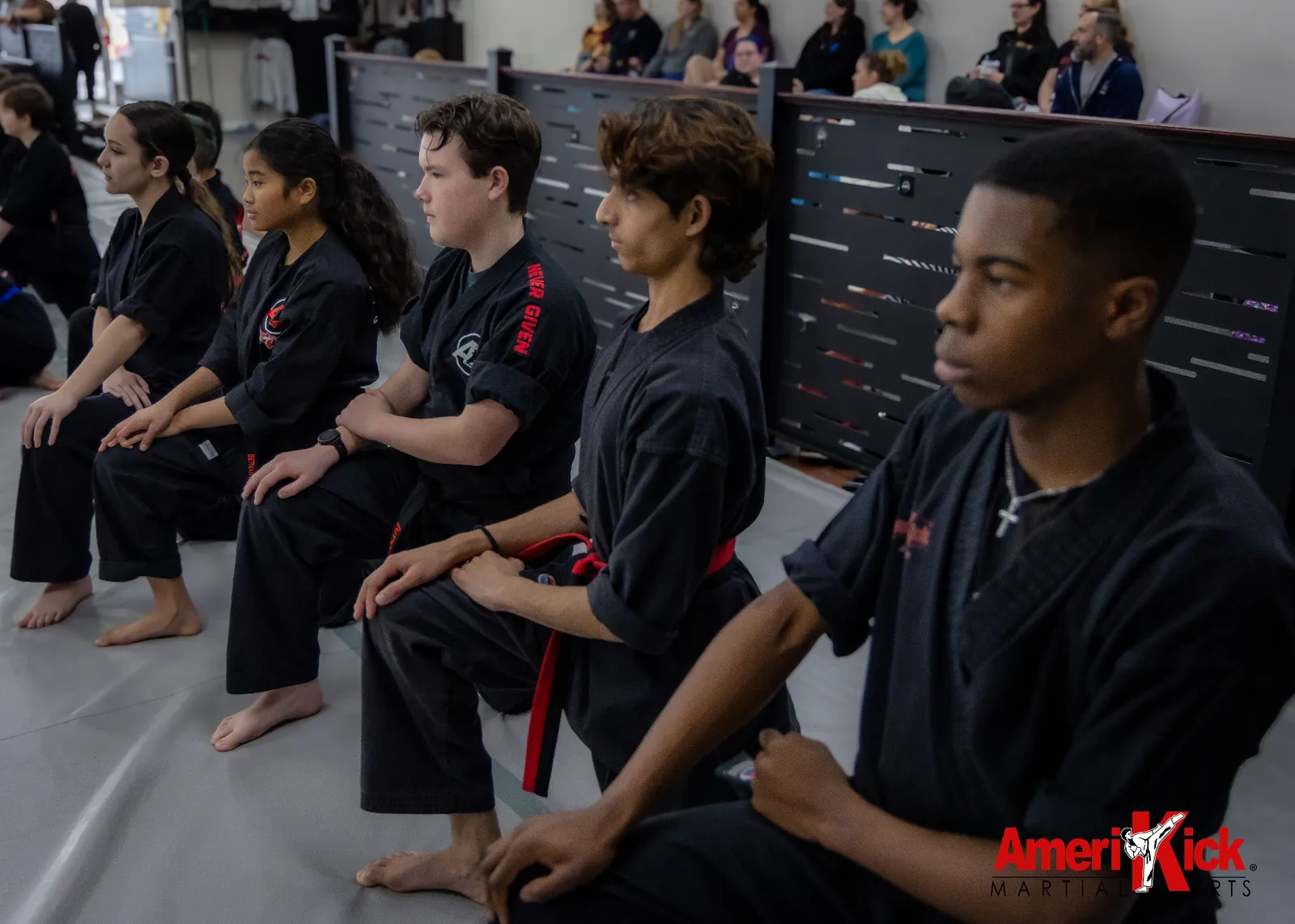 Amerikick Pennington students kneeling at attention