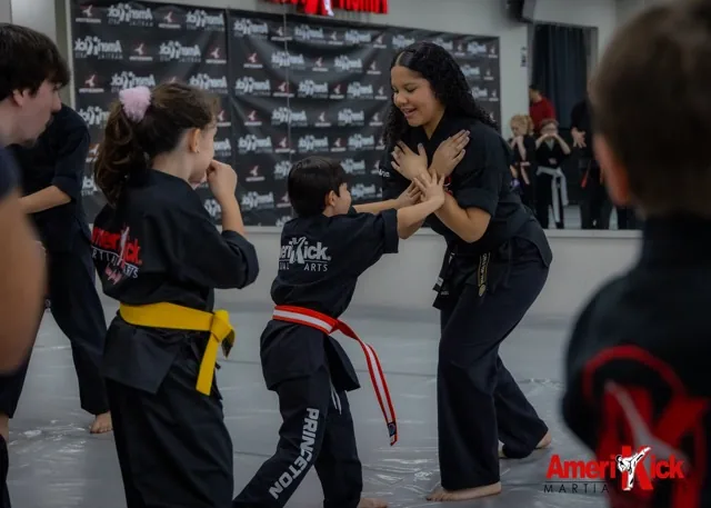 Amerikick Pennington students drilling partner self-defense